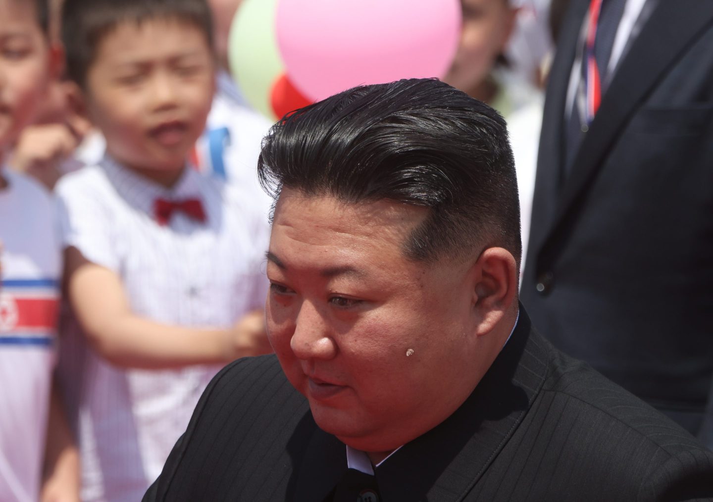 North Korean Supreme Leader Kim Jong Un greeting children in 2024.