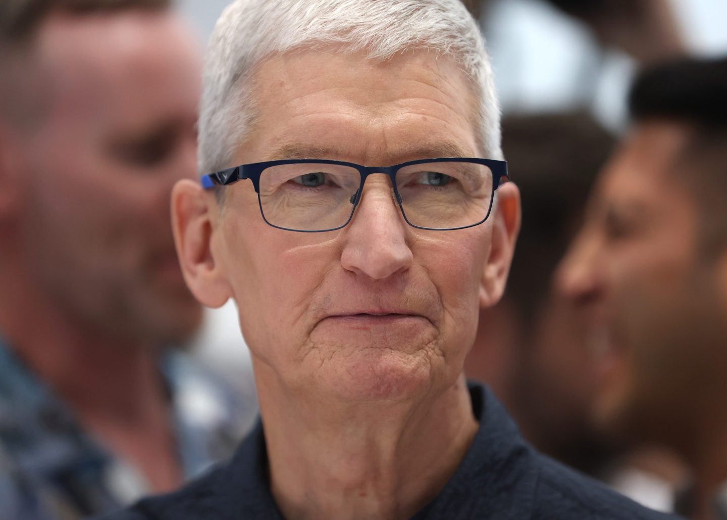 CUPERTINO, CALIFORNIA - SEPTEMBER 09: Apple CEO Tim Cook inspects the new iPhone 16 during an Apple special event at Apple headquarters on September 09, 2024 in Cupertino, California. Apple held an event to showcase the new iPhone 16, Airpods and Apple Watch models. (Photo by Justin Sullivan/Getty Images)